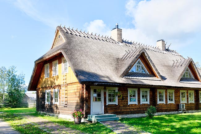 A house with two small chimneys on the roof